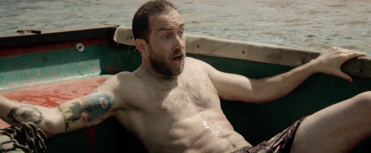 Man in The Endless Chained to a boat in his boxers