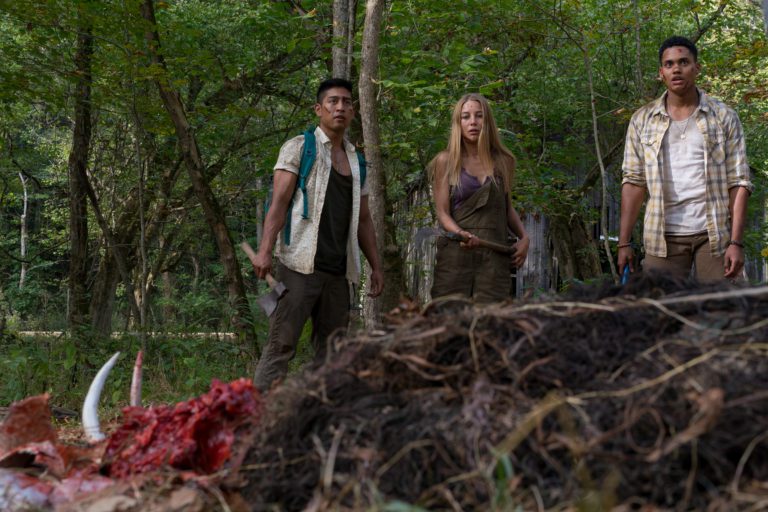 Adrian Favela as Luis, Charlotte Vega as Jen, and Adain Bradley as Darius in the horror film, WRONG TURN, a Saban Films release. Photo courtesy of Saban Films.