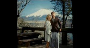 Rachel Taylor and Joshua Jackson as Jane and Ben pose in front of Mt. Fuji in the movie Shutter